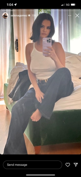 Selena Gomez wore a simple white tank top and jeans in a new photo shared to her Instagram Story on Friday. See the look.