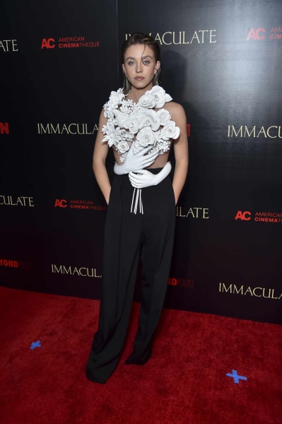 Sydney Sweeney attended the Los Angeles premiere of her new horror movie 'Immaculate' in a white sculptural top and no bra.