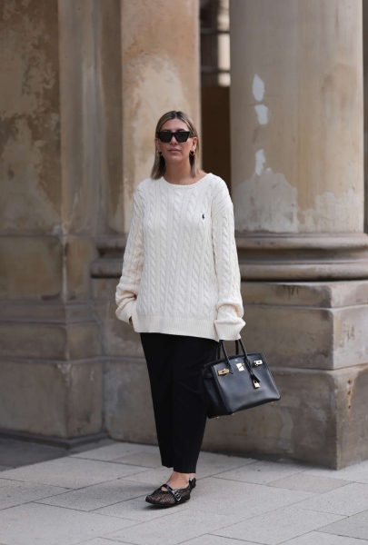The oversized sweater might feel intimidating, but chunky sweaters, tunics, knits, and cardigans are actually your best friend in cold and transitional weather. Here are the best ways to wear them.