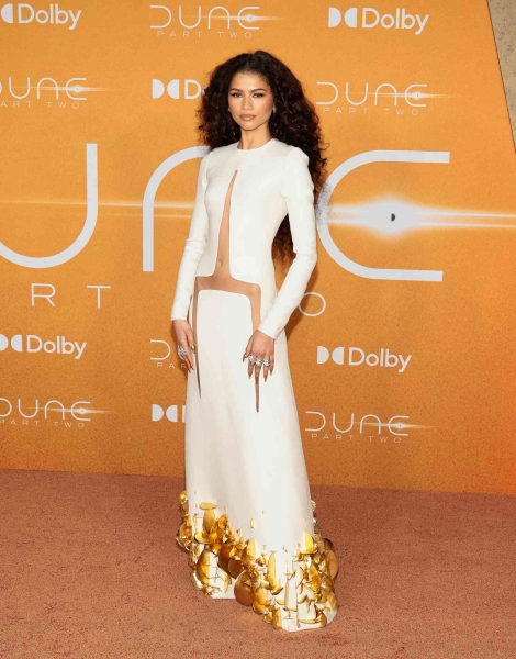 Zendaya arrived on the 2024 Oscars red carpet wearing a pink metallic Armani Privé gown.