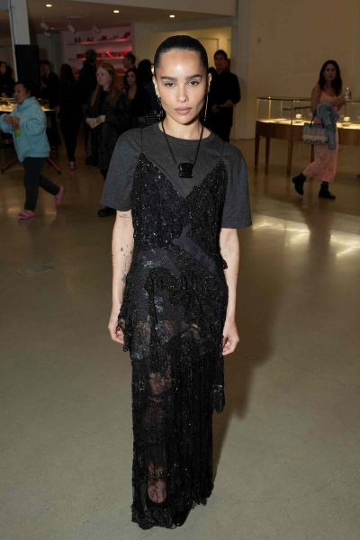 Zoë Kravitz attended Saint Laurent's pre-Oscar party in Los Angeles on Friday, wearing a sheer black gown with a back cutout.