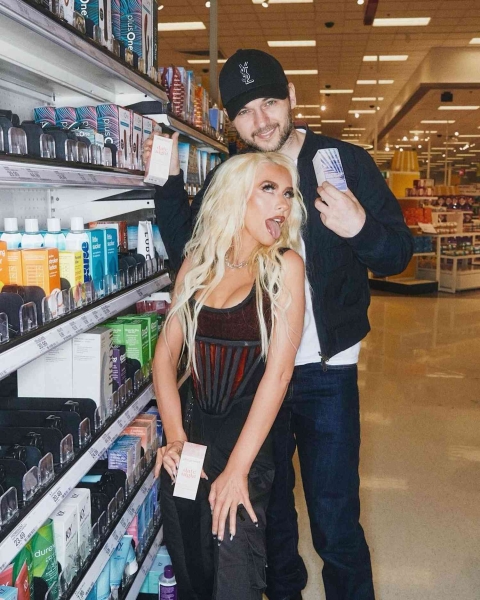 Christina Aguilera celebrated the launch of her sexual wellness line, Playground, at Target. See the corset and cargo pants outfit she wore to the store, here.