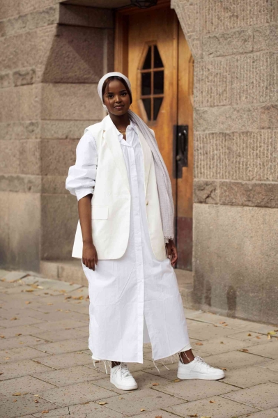 Discover the versatility of white sneakers this spring with our style guide. Featuring 12 unique outfits, learn how to pair this classic footwear with everything from chic suits to casual capris, proving that white sneakers are the ultimate wardrobe staple for the season.