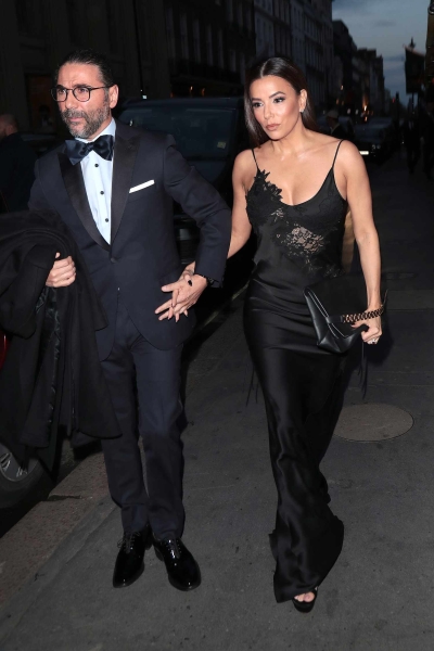 Eva Longoria attended Victoria Beckham's 50th birthday party in London while wearing a black sheer lace slip dress.