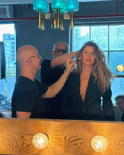 In her latest Instagram post, Gisele Bundchen shared a behind-the-scenes look at her new photoshoot, including a shot of her wearing a Celine bathing suit with a leopard-print pattern and a huge midsection cutout.