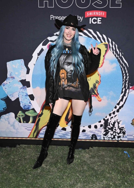 Megan Fox made an appearance at Coachella while wearing blue hair extensions and no pants on Friday.