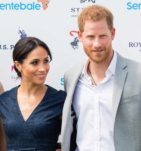 Meghan Markle wore a halter dress with a midriff cutout to the Royal Salute Polo Challenge in Florida. See the look, here.