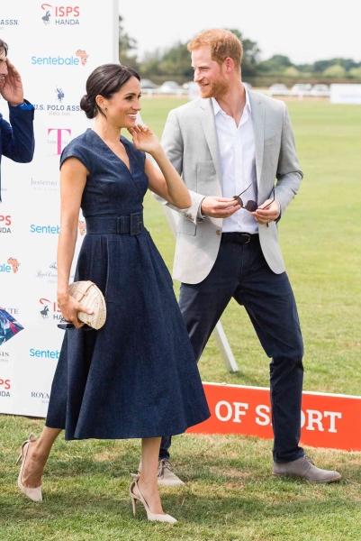 Meghan Markle wore a halter dress with a midriff cutout to the Royal Salute Polo Challenge in Florida. See the look, here.