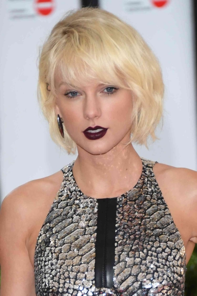 Taylor Swift's bangs are a reliable beauty note that changes as constantly as the pop star's public persona. Here, we take you through their evolution in photos.