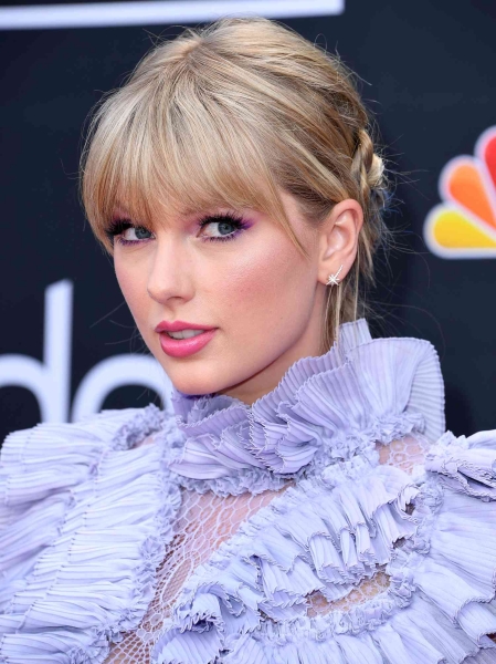 Taylor Swift's bangs are a reliable beauty note that changes as constantly as the pop star's public persona. Here, we take you through their evolution in photos.