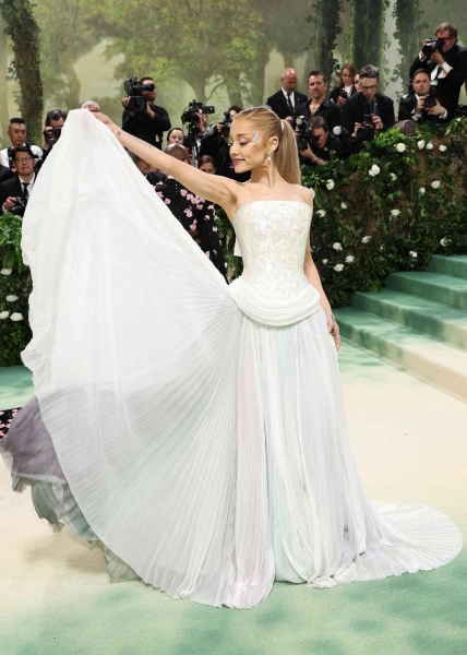 Ariana Grande wore a Loewe dress with a mother-of-pearl bodice and a nod to her 'Wicked' character to the 2024 Met Gala. See the full look, here.