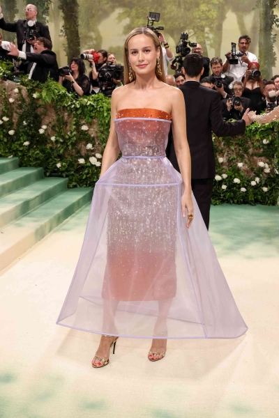 Brie Larson attended the 2024 Met Gala wearing a double-layered Prada dress. See her full sculptural look from every angle here.