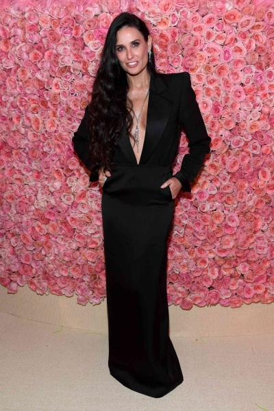 For her fifth appearance at the Met Gala, Demi Moore wowed in a structural pink and black gown made of vintage wallpaper. See her look from all angles here.