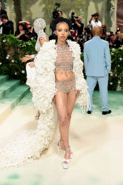 From barely-there sheers to floral fantasies, these are the sexiest looks spotted on the 2024 Met Gala red carpet worn by Emily Ratajkowski, Emma Chamberlin, Jennifer Lopez, and more.