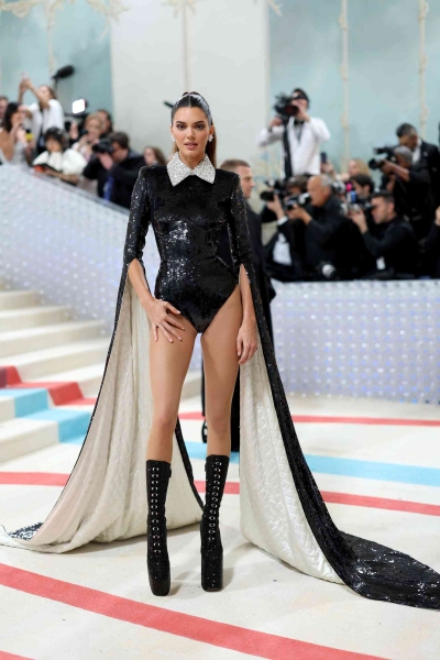 Kendall Jenner wore a plunging black gown with a sheer V-shaped panel to the 2024 Met Gala. See the full look, here.