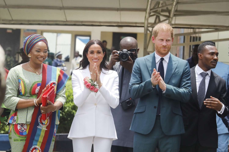 Meghan Markle and Prince Harry's busy Nigerian tour continues with a visit to the chief of defense staff headquarters. Meghan wore a bright white suit from Altuzarra.