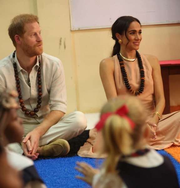 Meghan Markle wore a diamond cross necklace that once belonged to Princess Diana during her Nigerian tour on May 11.