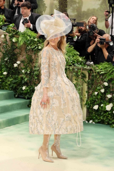 Sarah Jessica Parker wore a Richard Quinn dress covered in flower embellishment to the 2024 Met Gala. See the look, here.