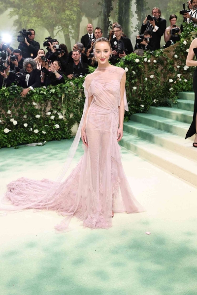 The 2024 Met Gala is a star-studded occasion like no other, and we've got the red carpet photos to prove it. See all the celeb arrivals, including Emma Chamberlain, Jennifer Lopez, and more at this year's Met Gala right here.